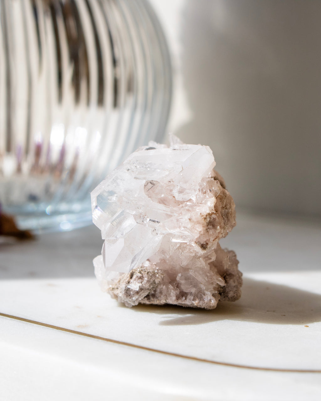 A clear crystal with a blurred natural background