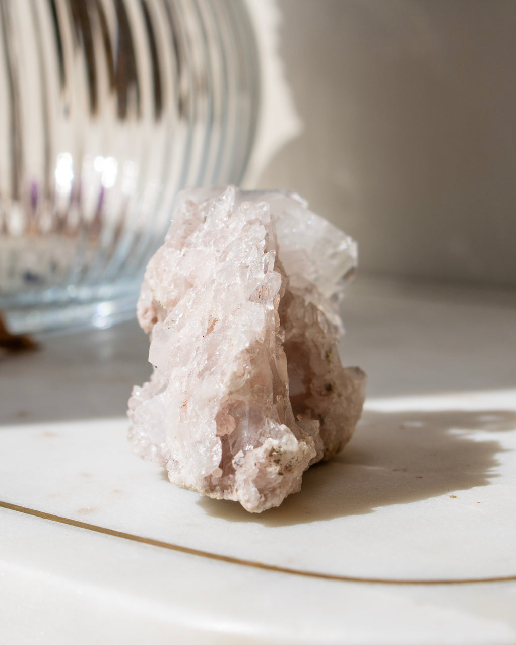 A clear crystal with a blurred natural background