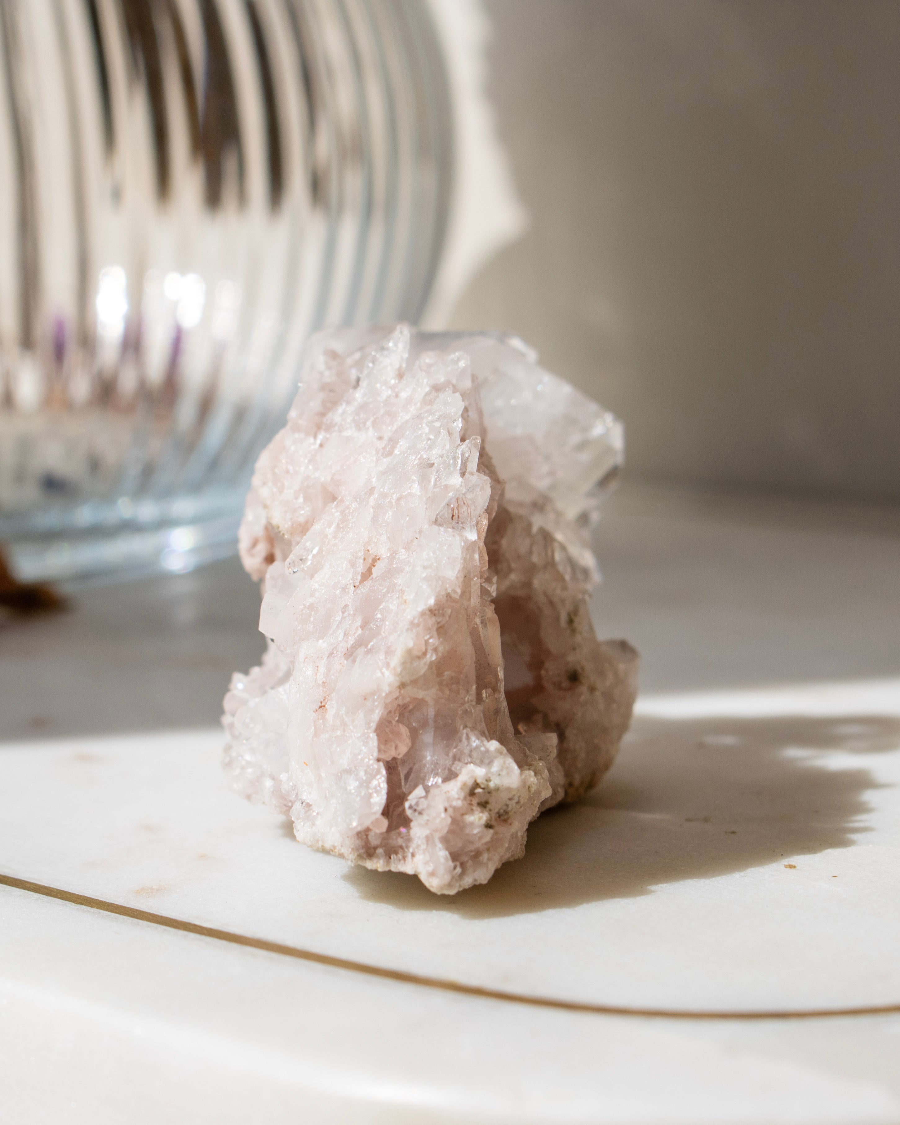 A clear crystal with a blurred natural background