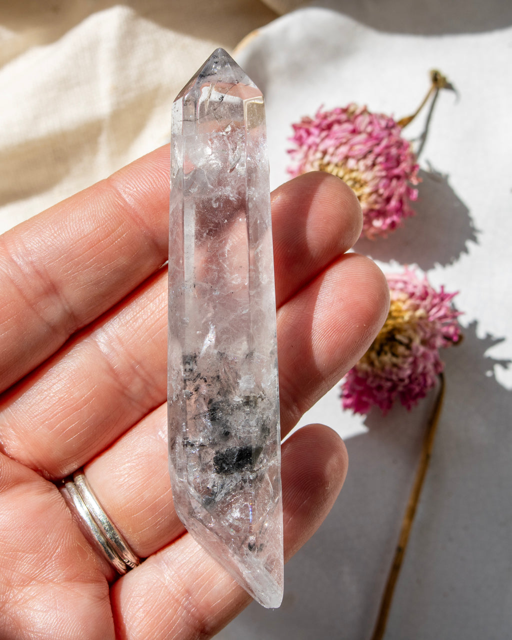 a clear crystal being held