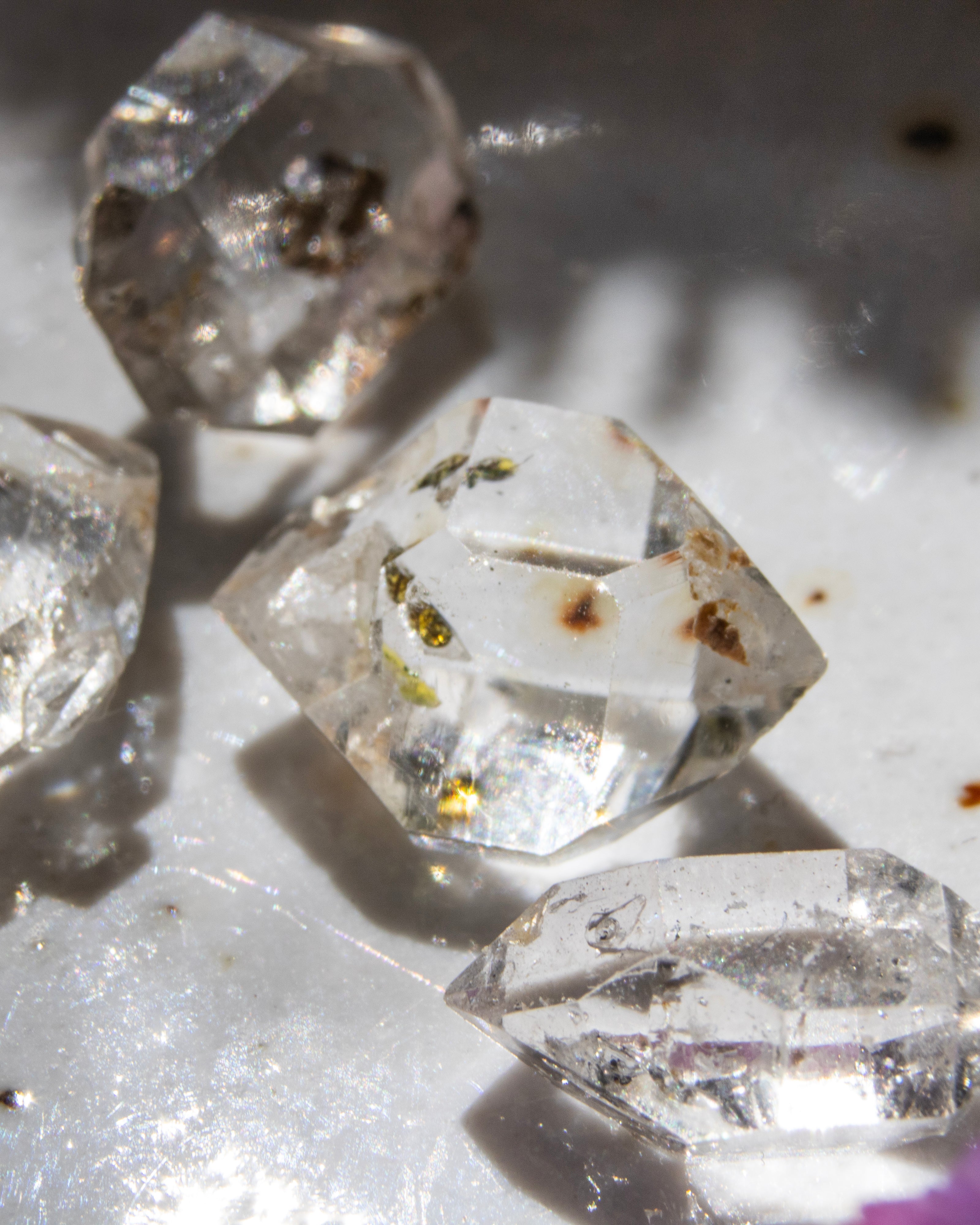 Close-up of crystal-like objects on a white surface