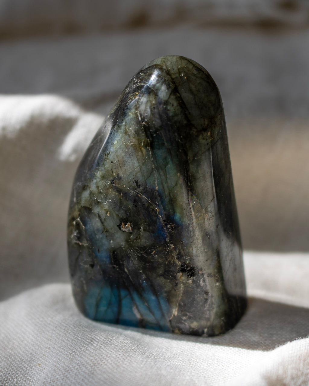 Labradorite stone on a textured surface
