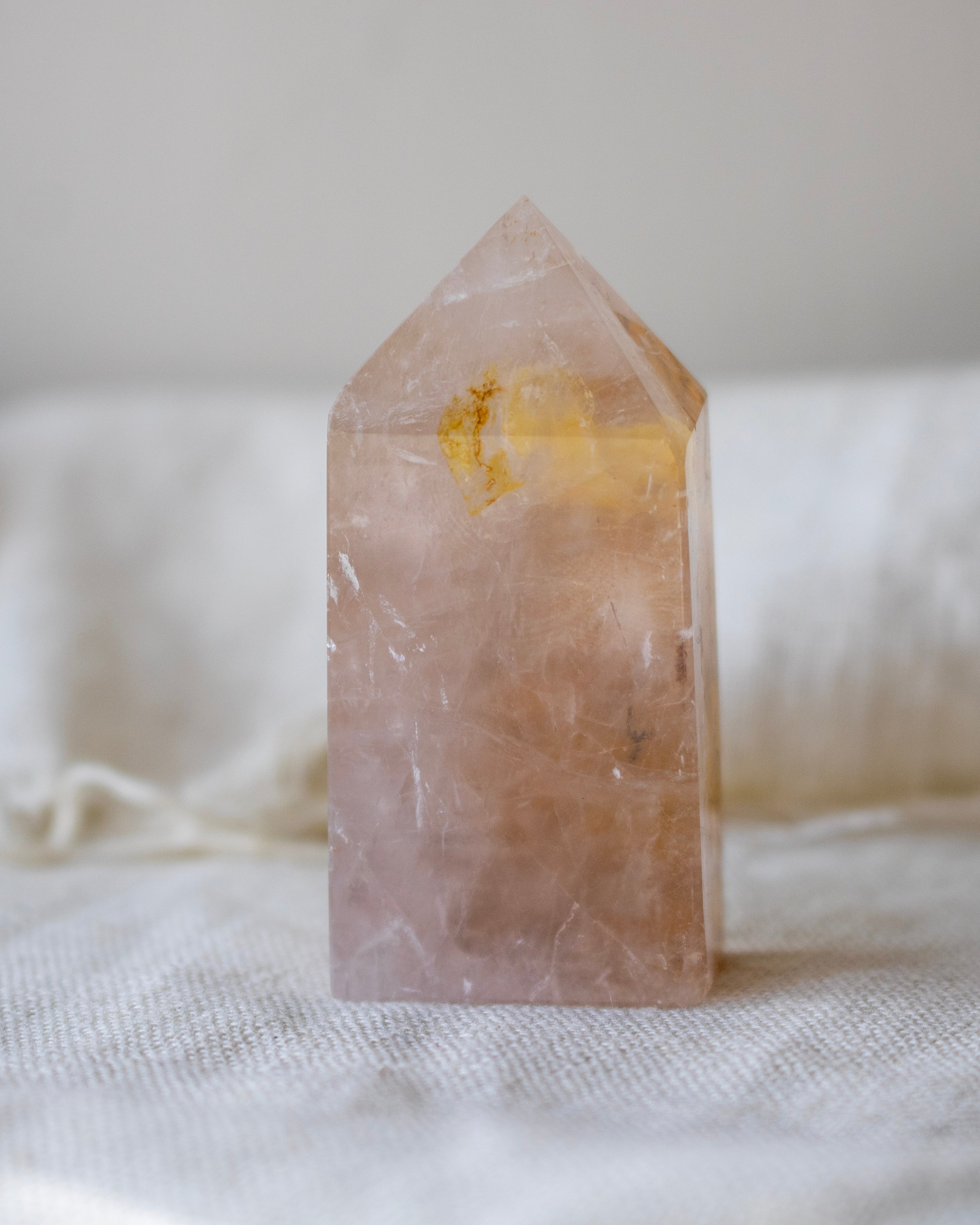 Crystal tower on a white fabric background