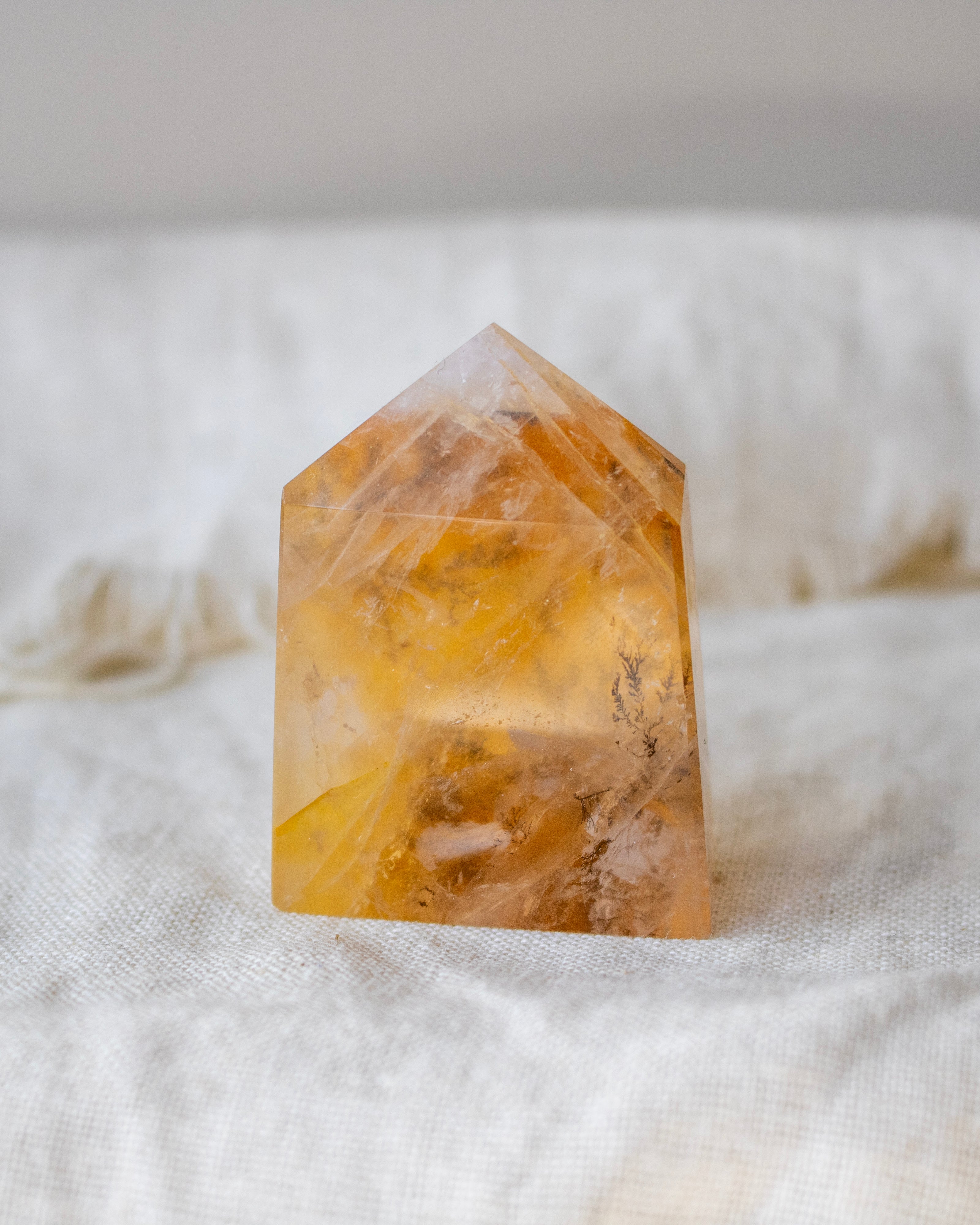Crystal tower on a white fabric background