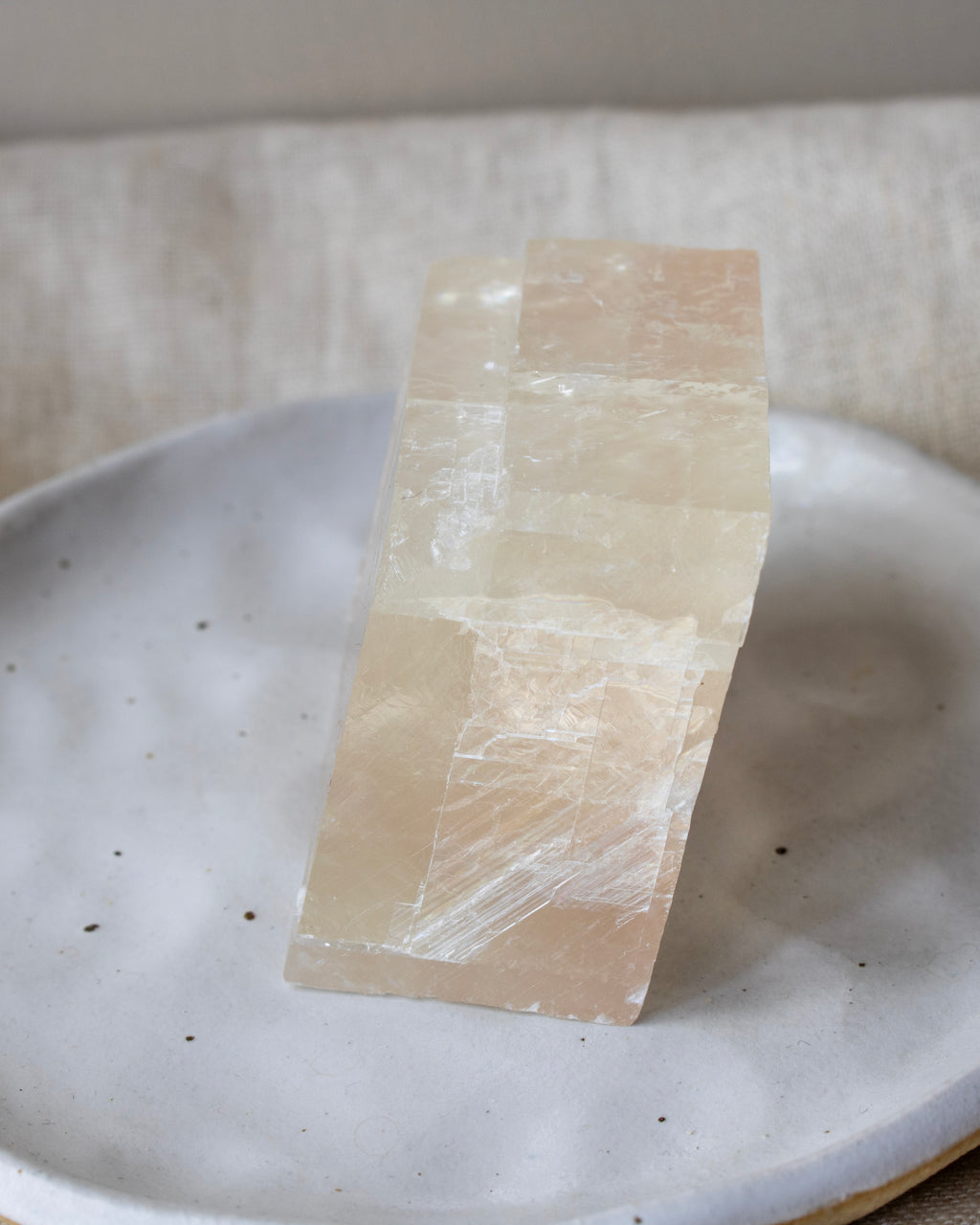 Rectangular stone on a textured white plate