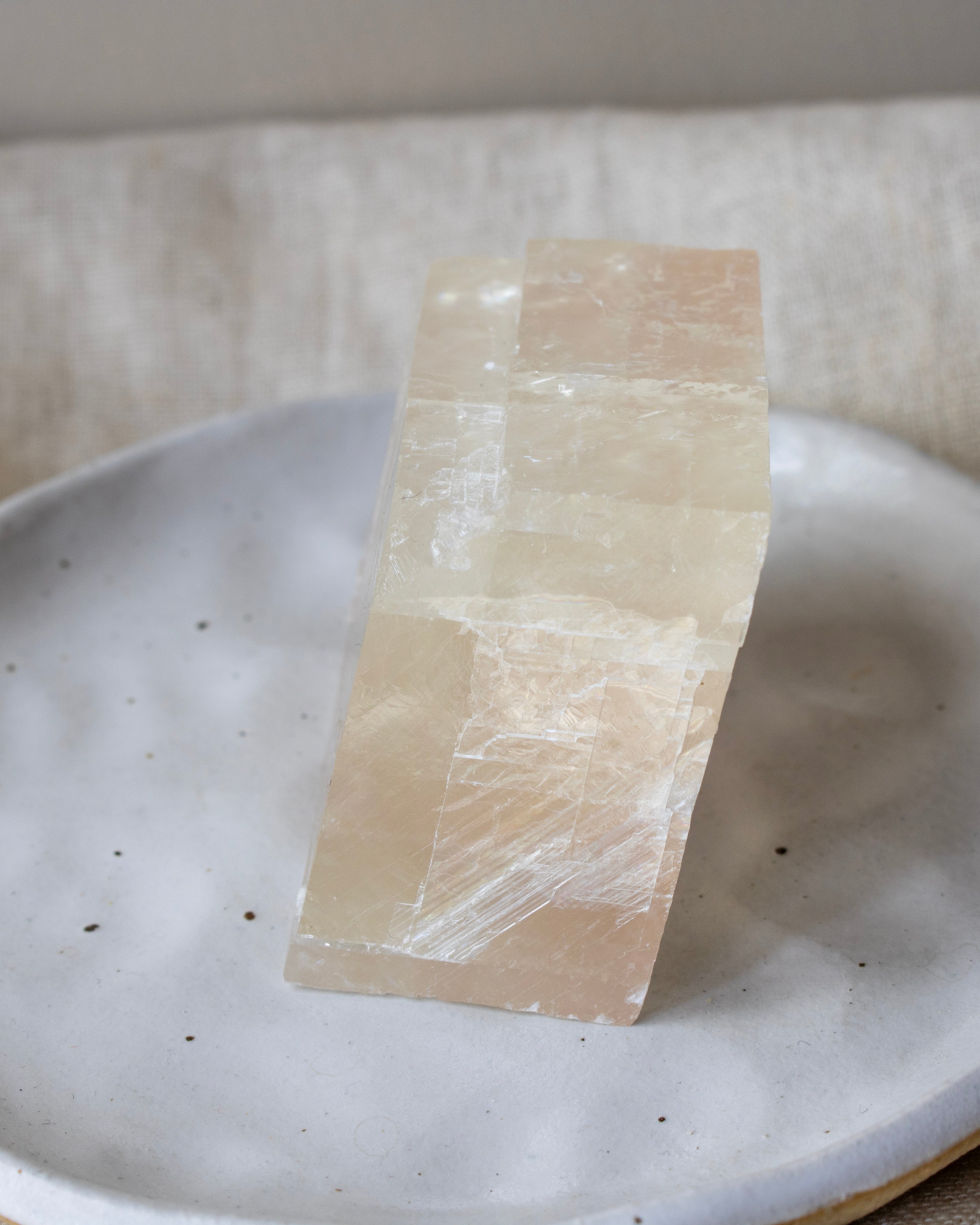 Rectangular stone on a textured white plate