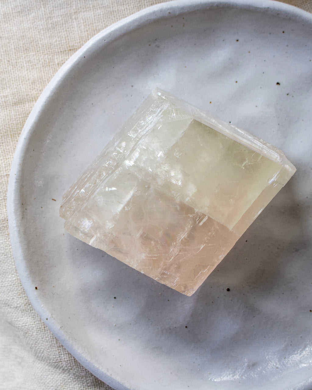 Clear crystal on a white ceramic plate