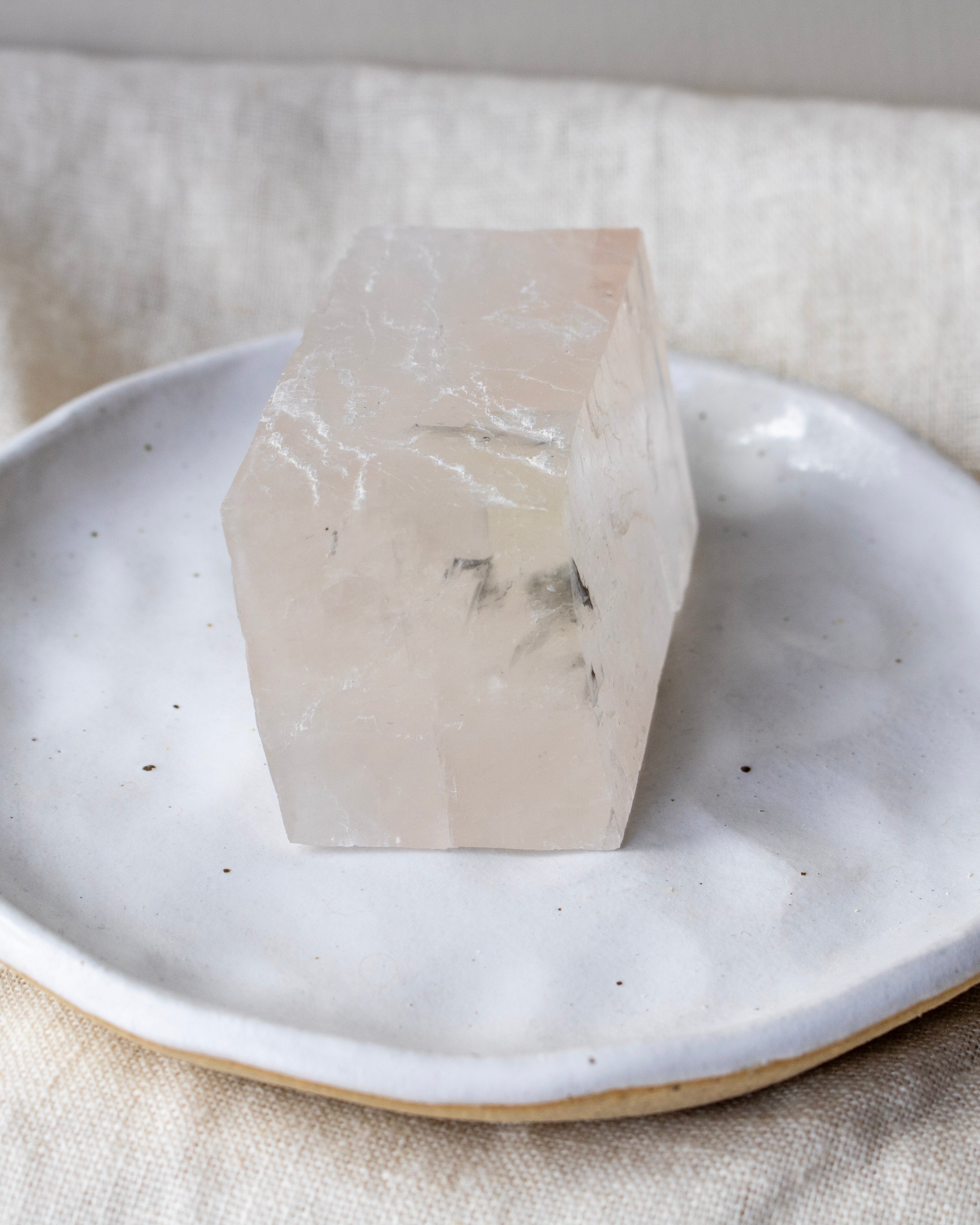 Crystal on a white plate with a neutral background