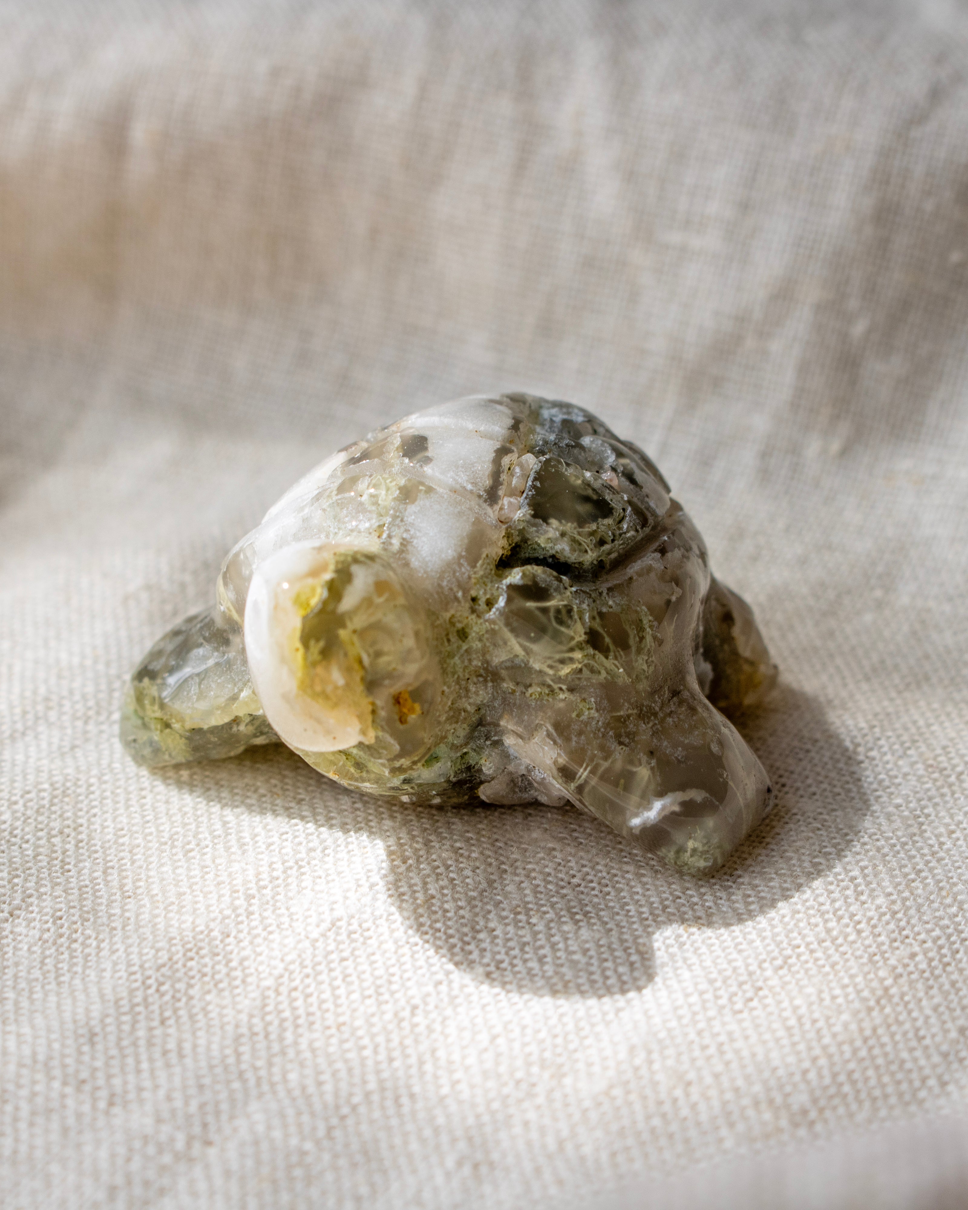 Mineral specimen on a textured beige fabric background