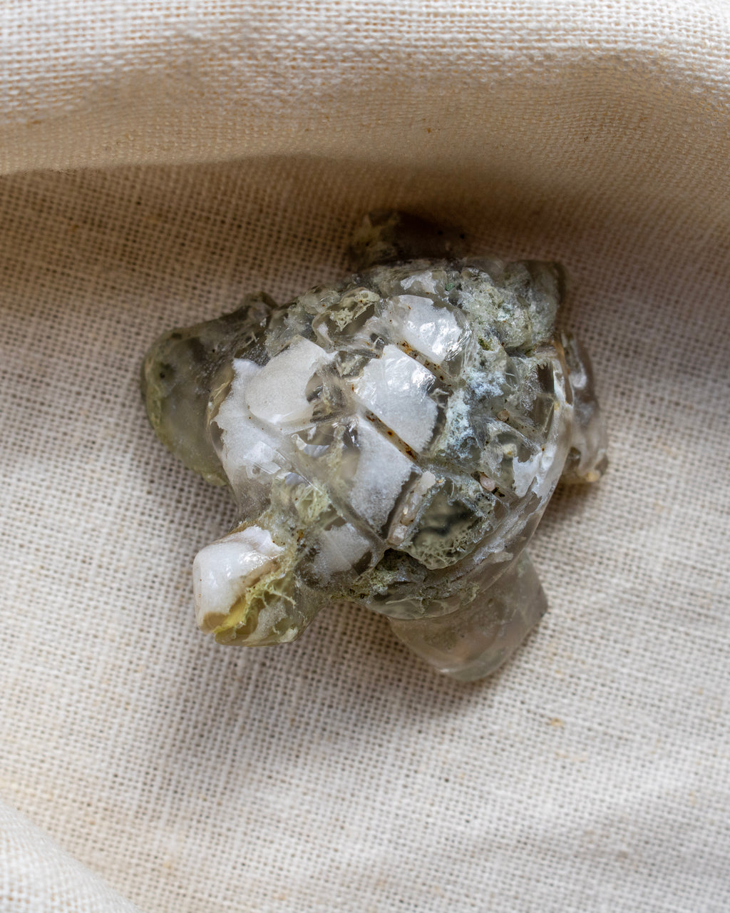 Mineral specimen on a beige fabric background