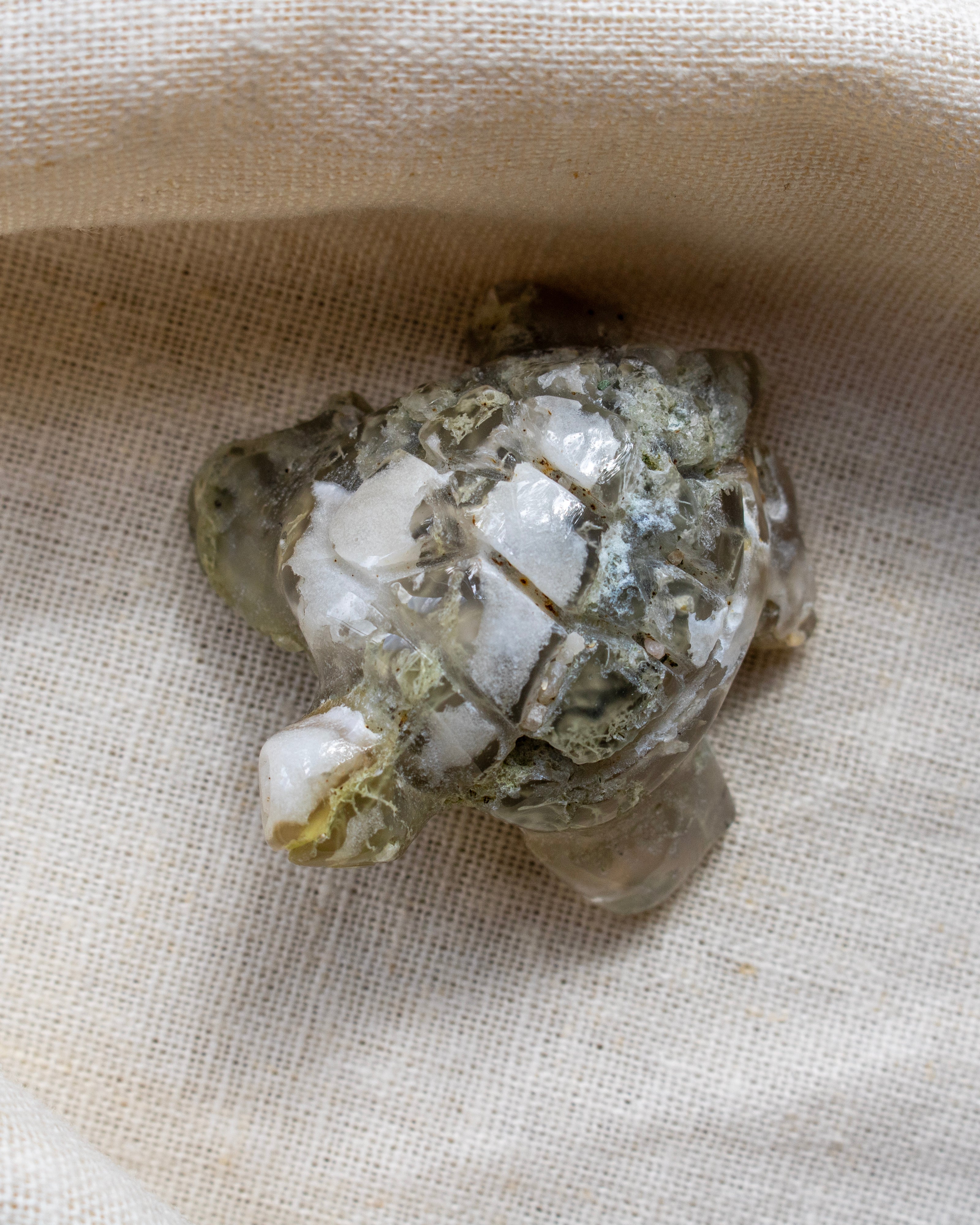 Mineral specimen on a beige fabric background