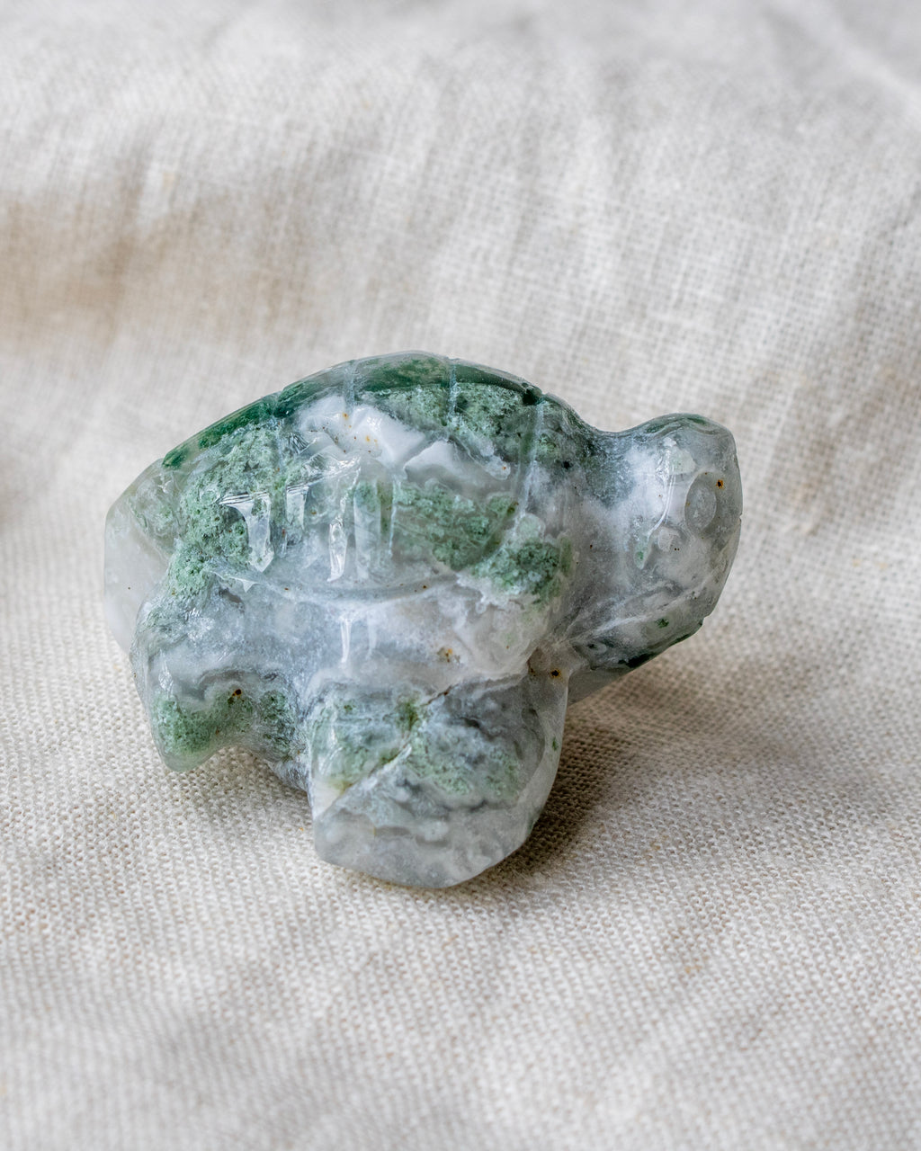 Crystal turtle on a light fabric background