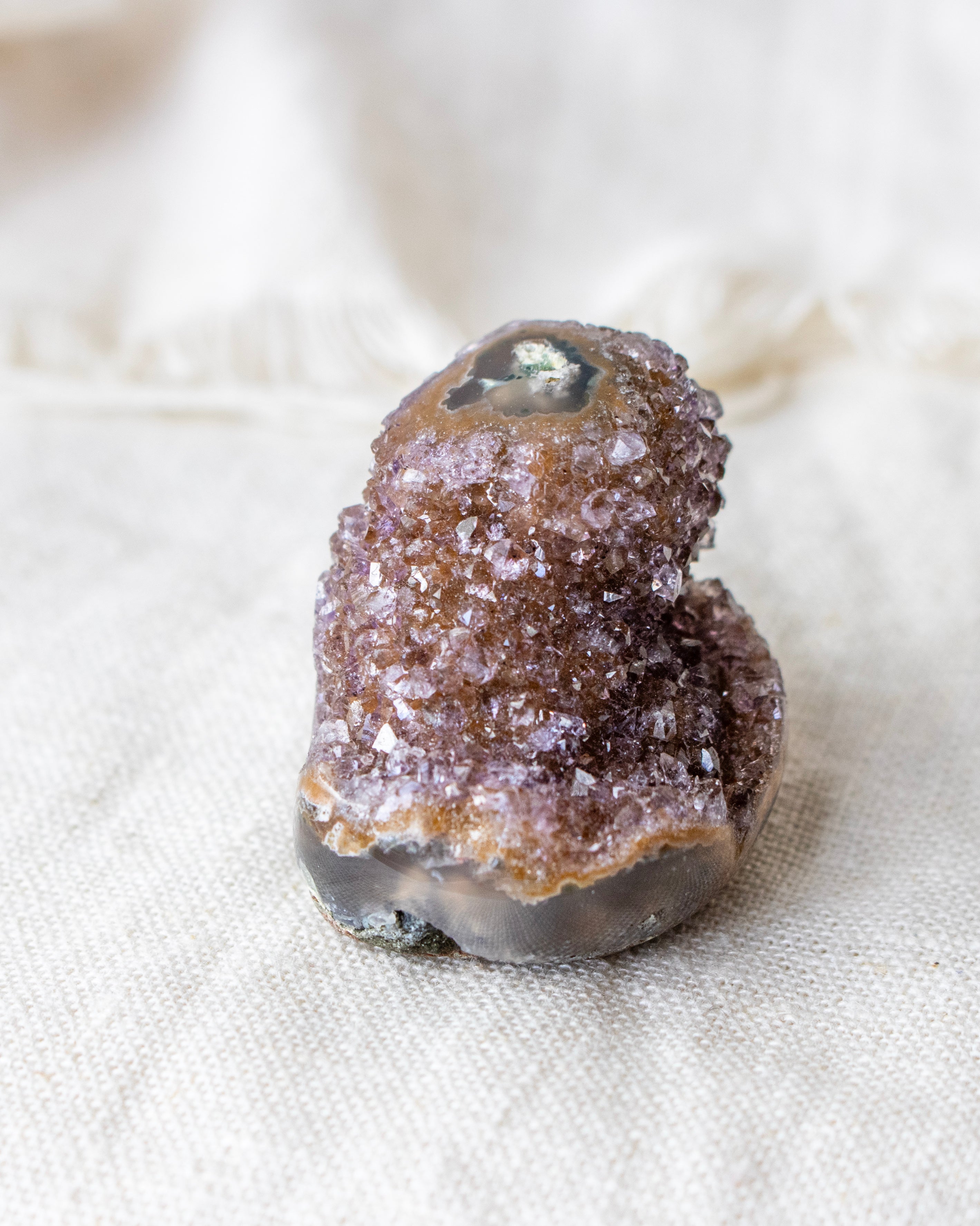 Mineral specimen on a textured fabric background