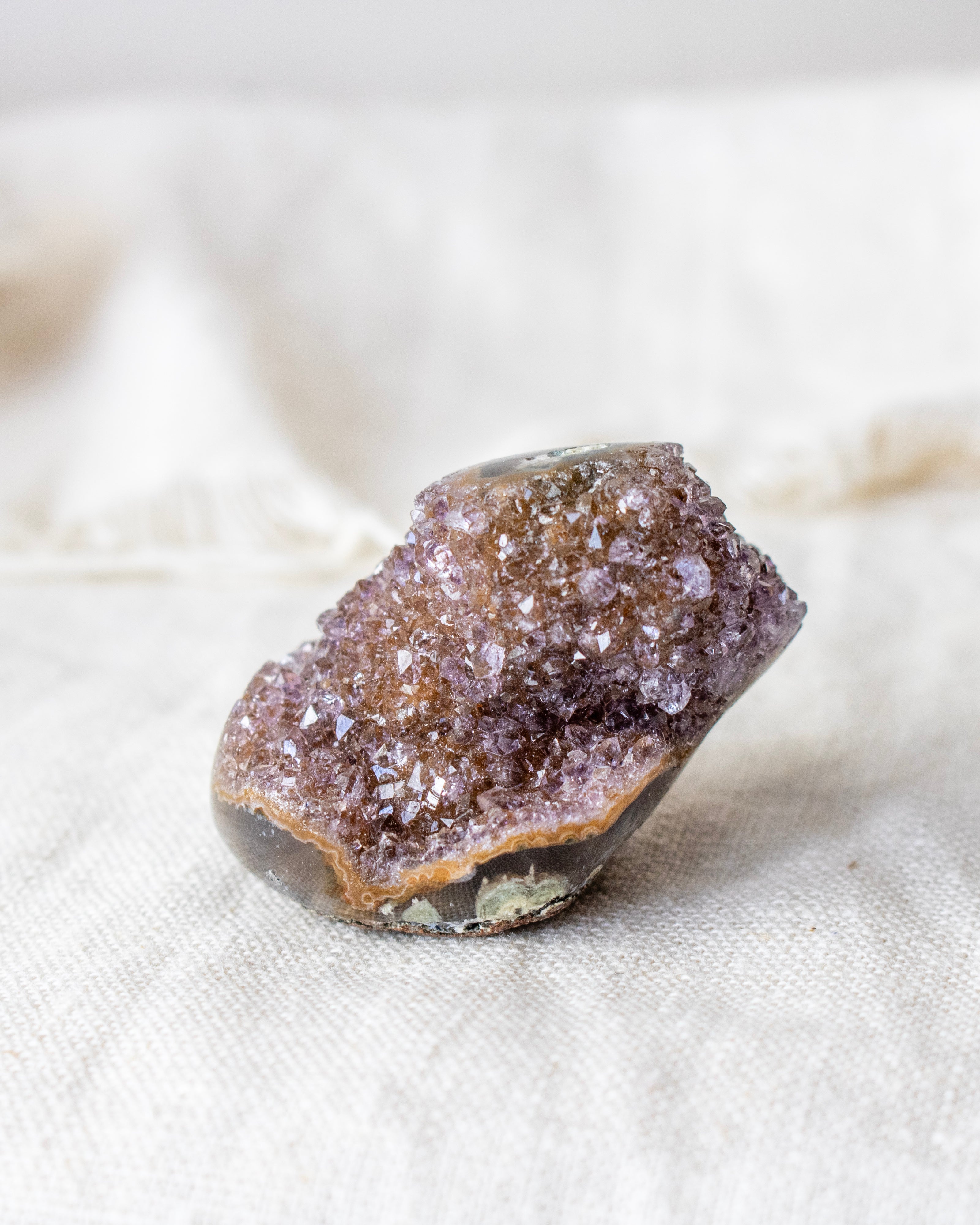 Crystal rock on a textured beige surface