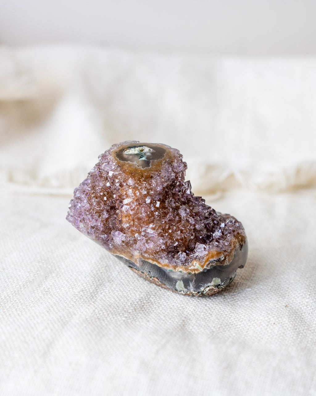 Mineral specimen on a white fabric background