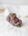 Mineral specimen on a white fabric background