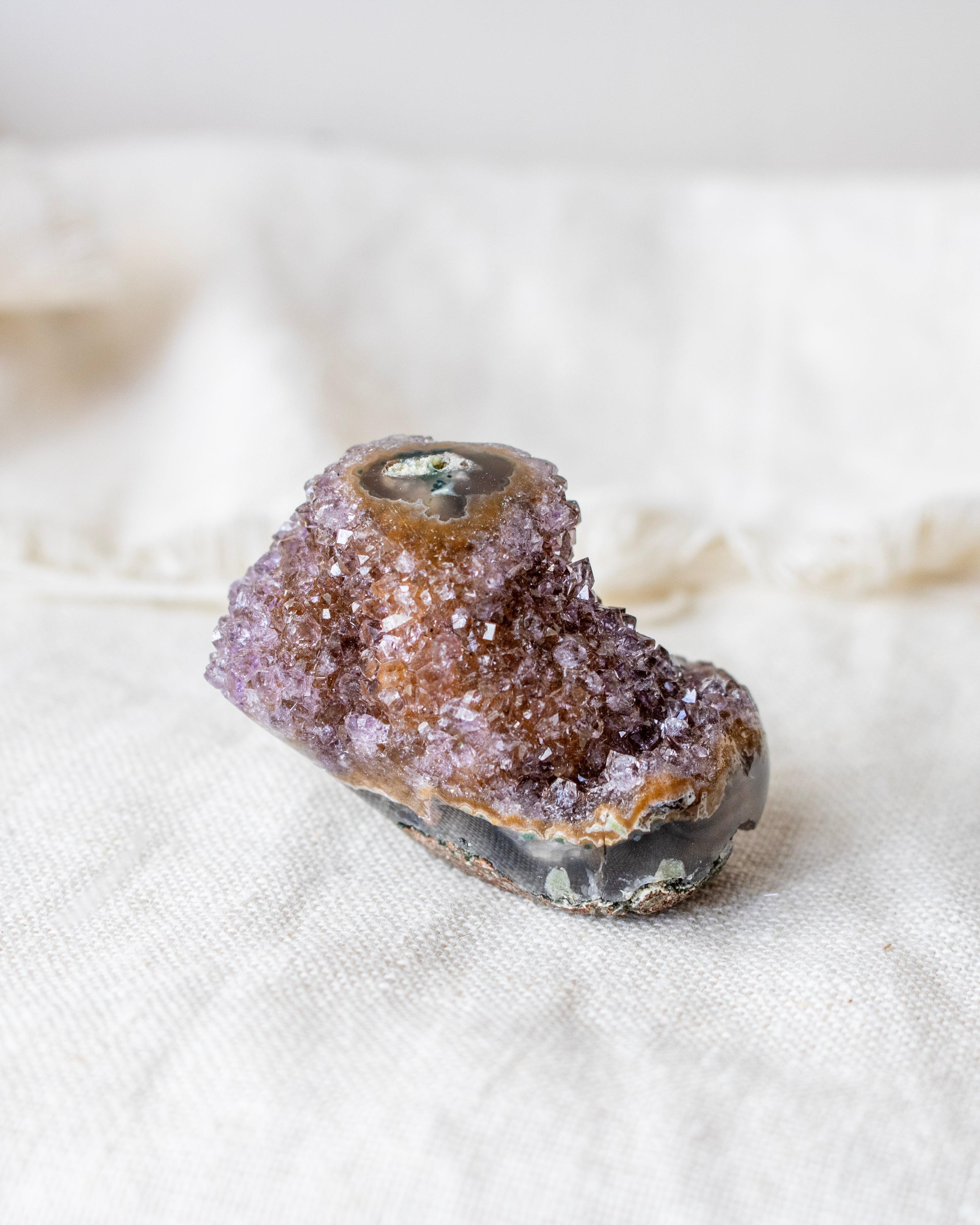 Mineral specimen on a white fabric background