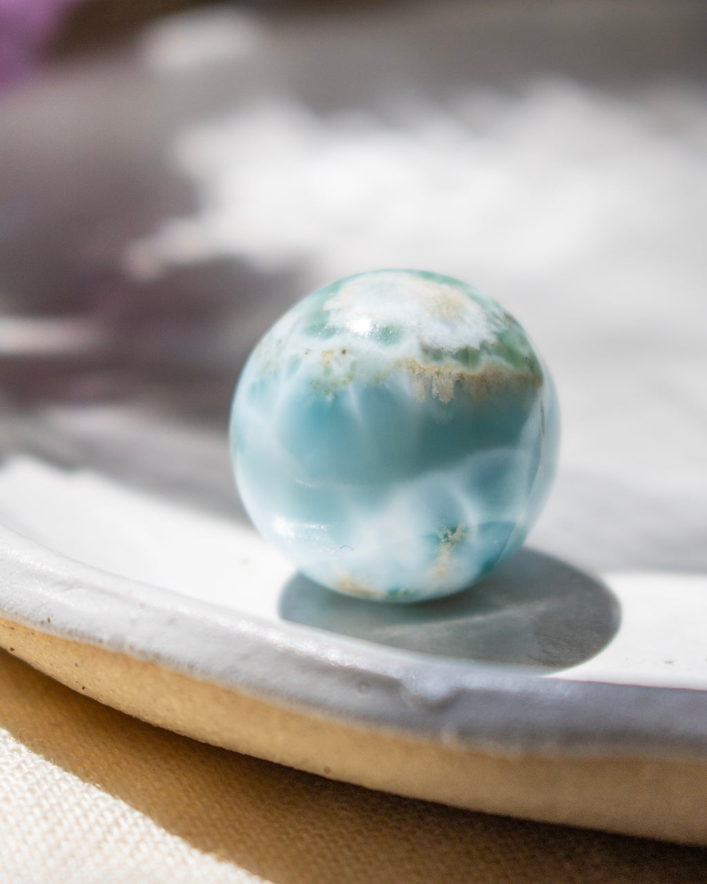 Marble-like sphere on a textured surface