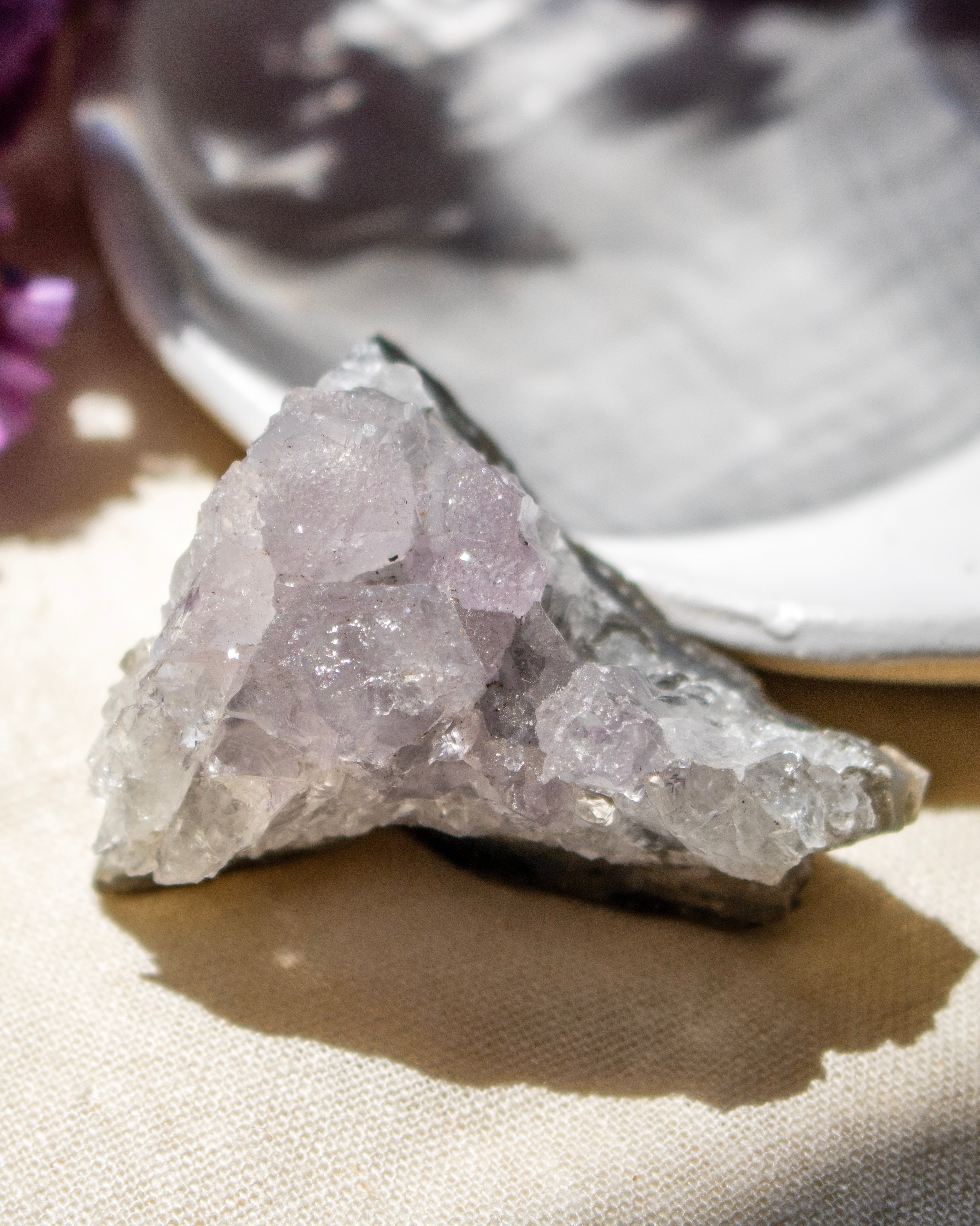 Crystal rock on a textured surface with a blurred background