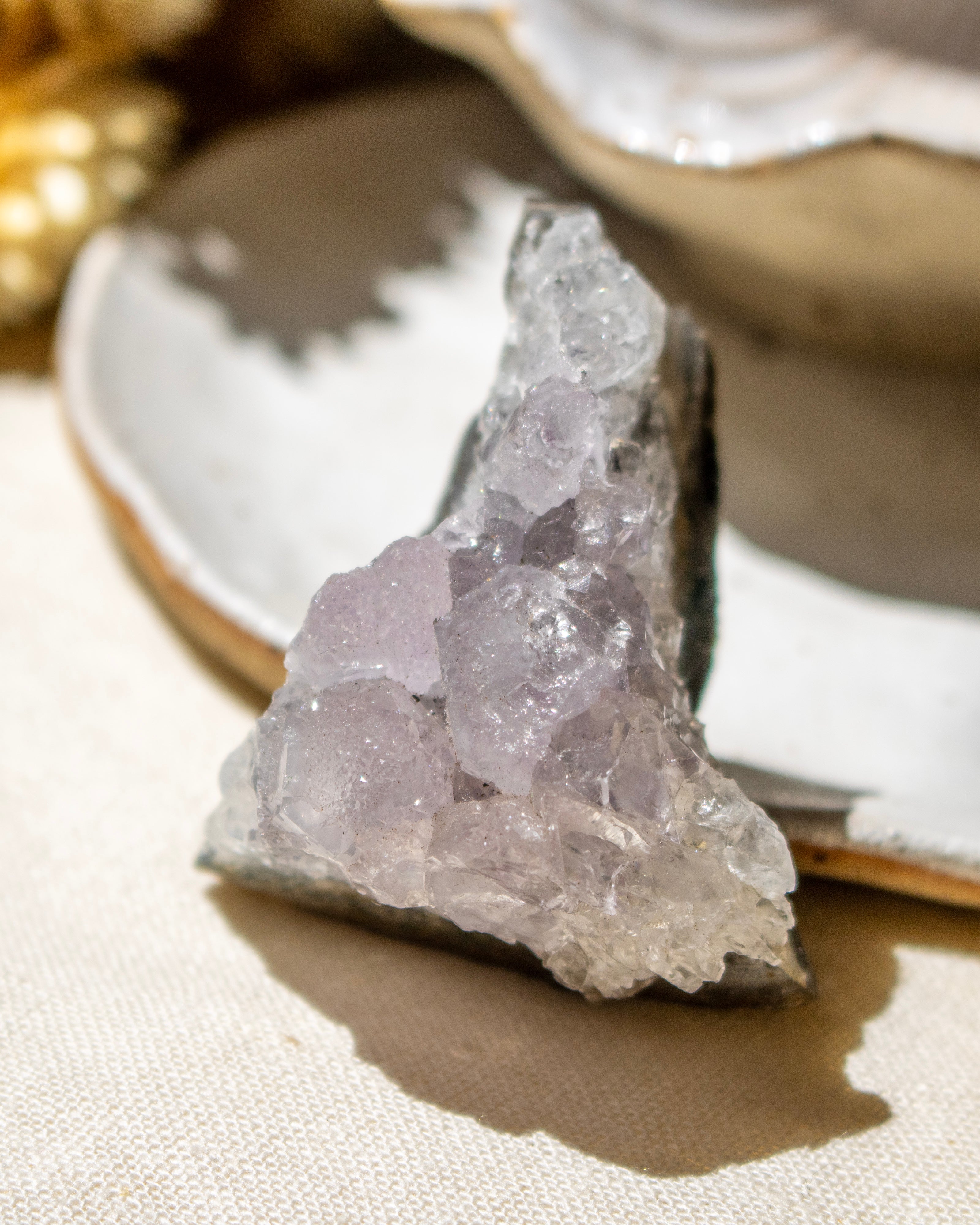 Crystal rock on a textured surface with a blurred background